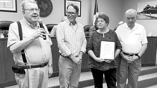 The Taylor Kiwanis Club was recently recognized for its 100 years of service by the Taylor City Council. Kiwanis President Rev. Travis Summerlin accepts the proclamation from Councilman Mitch Drummond. Also in attendance were Kiwanis secretary Karen Ellis and former Kiwanis president and A...