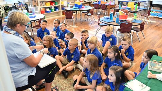 St. Mary’s Catholic School first grader listen intently as Betsy Hime teaches Heggerty Aug. 11.