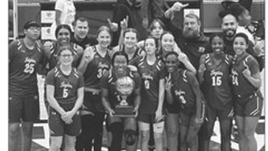 The Taylor High School girls varsity basketball team proudly poses together on Feb. 13 after defeating Houston Kashmere High School 55-27 in a bidistrict playoff game. Photo courtesy of Taylor ISD