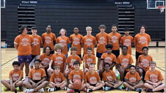 Hutto boys campers from grades three through nine happily pose together for a photo on June 6 during the first day of Hippos Youth Basketball Camp. Photo courtesy of Hutto ISD