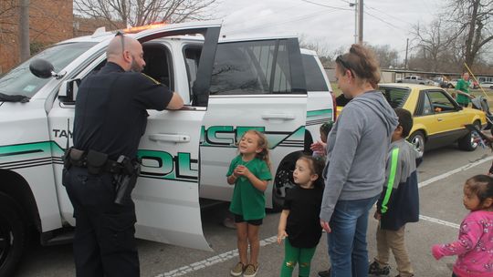 Sgt. Sam Brister (left) talks with children during the Truck Petting Zoo at the Taylor Public Library in Taylor March 17.   Photo by Fernando Castro