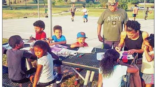 Children of all ages come together at Midnight Basketball in Fannie Robinson Park, the precursor to Basketball in the Park in this 2017 photo. File photo