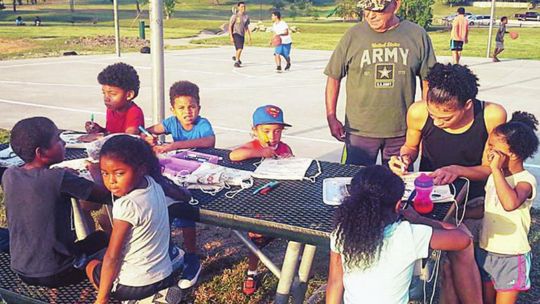 Children of all ages come together at Midnight Basketball in Fannie Robinson Park, the precursor to Basketball in the Park in this 2017 photo. File photo