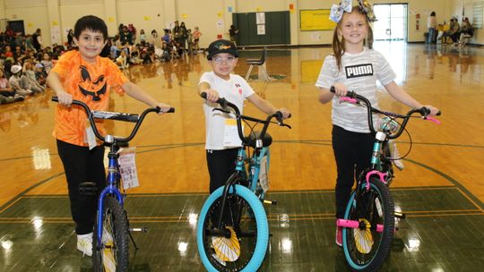 Pasemann students (from left) Hugo Marquez (fourth grade), Rhett Barcuch (second grade) and Kyleigh Harding (third grade) are shown with the new bikes they were awarded for good behavior.tudents with no office referrals for the first nine weeks of school were entered into a drawing for a c...