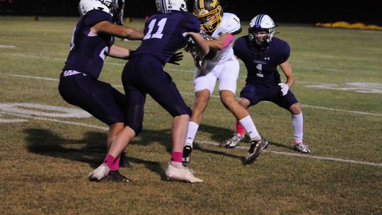 [12:08 AM] Evan Hale Thrall defenders converge and prepare to tackle on Thorndale ball carrier. Photo by Larry Pelchat