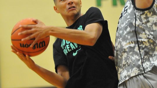 A player goes for a basket during a past Taylor Press 3-on-3 Basketball Tournament. The Tournament returns this summer. Photo by Larry Pelchat