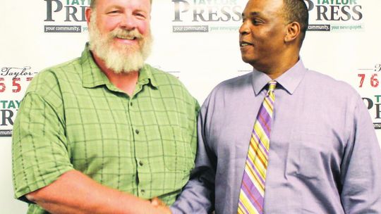 Stan Werner (left) and Gerald Anderson shake hands after the candidate forum at the Taylor ISD Main Streets Event Center in Taylor April 11. Photos by Fernando Castro