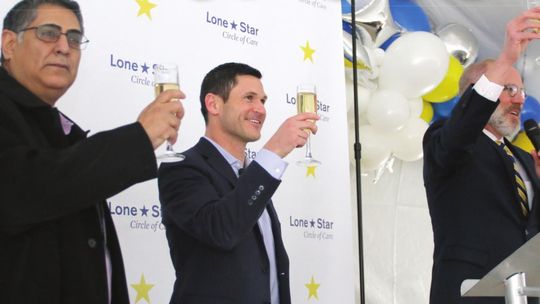 (From right to left) Mayor Brandt Rydell proposes a toast with Jon Calvin, CEO, and Marco Cruz, Executive Director, to celebrate the opening of Lone Star Circle of Care. Photos by Jason Hennington