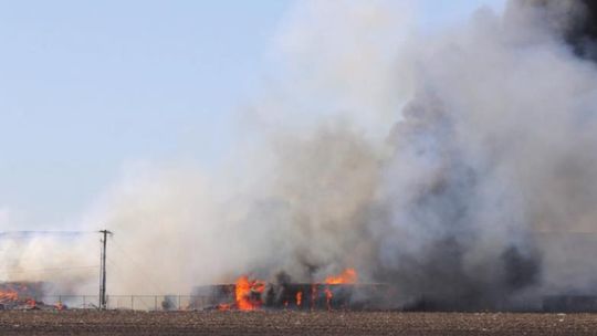 The Balcones Resource recycling center caught on fire Friday afternoon. A firefighter from Taylor and a firefighter from Jarrell were injured and taken to the hospital while combating the fire. Photo by Jason Hennington