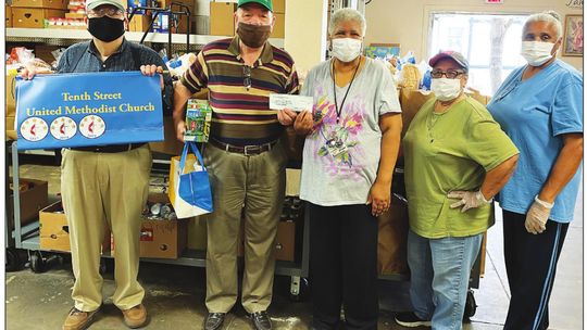 CHURCH DONATES TO PANTRY