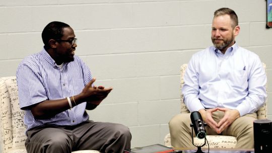 Taylor Press Area Editor Jason Hennington chats with City Manager Brian LaBorde Dec. 12 at the Taylor Press studio. Photo by Nicole Lessin