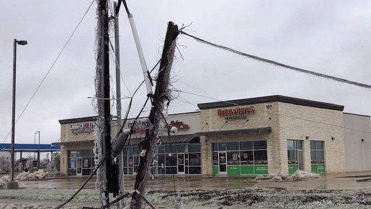 A damaged utility pole lies on the ground Feb. 2 along Carlos G. Parker Boulevard Northwest in Taylor. Photo by Ann Miller