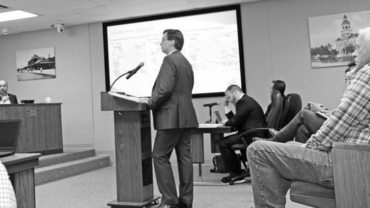 Colin Harrison, who was recently promoted to director of Development Services for the city, gives a staff report on the proposed 160-foot wireless telecommunication tower, at the April 27 meeting of the Taylor City Council.