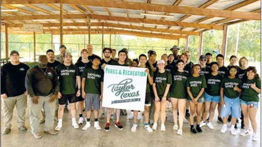 Samsung Austin Semiconductor interns pose with city officials after completing their volunteer work. Photos courtesy of Samsung Austin Semiconductor