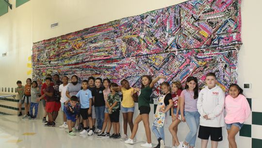 Naomi Pasemann Elementary students participated in a school community art project that involved weaving materials together to produce a mural for their school. The project was completed by art students under the direction of NPE art teacher, Jennifer Lindquist. Photo by Tim Crow