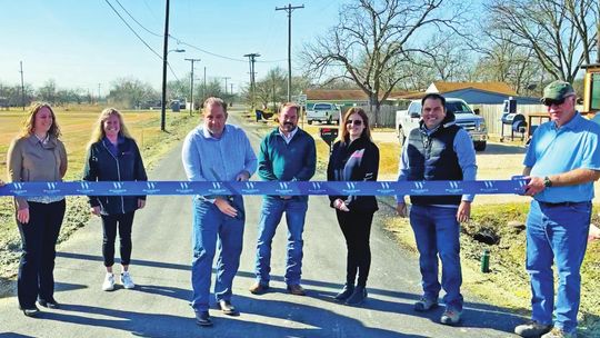 Pictured are Kim Scherer, HNTB; Tina Rutterford, Chasco Construction; Precinct 4 Commissioner Russ Boles; Mayor Chad Mees; Stacy Jo Hunter, Chasco Construction; Oscar Salazar-Bueno, HNTB; and Clayton Weber, HNTB. Courtesy photo