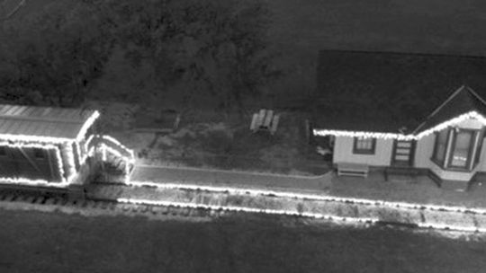 Coupland’s historic Depot and caboose decorated by Jonathan Jones. Drone photo by Max Marosko III, RaptAir.