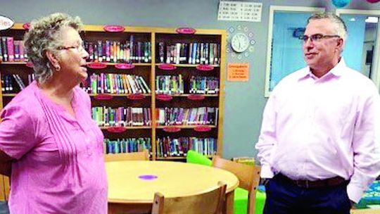 Coupland Civic Organization President Susan Schmidt visits with Dr. Saul Hinojosa, school superintendent search consultant.