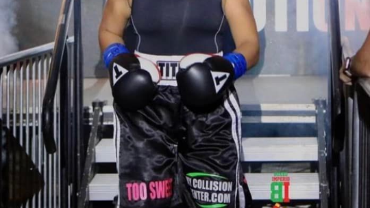 Fit to fight and ready to go. As usual Destiny “Too Sweet” Jones is all smiles as she prepares to go into battle in the ring. 