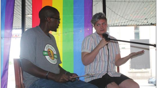 Jason Hennington talks with Red Bailey about the upcoming Taylor PRIDE festival during an interview at Texas Beer Company in Taylor June 15. Photo by Fernando Castro