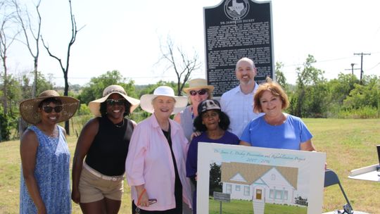 Dickey Museum board members and representatives from the Texas Historical Foundation attend a press conference to announce a $500,000 grant from the St. David's Foundation that will be used to build a replica of the home of Dr. James Lee Dickey. At the event are (from left) Linda Jackson,...