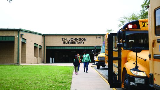 The district is implementing different measures to boost attendance, including at TH Johnson Elementary School, which has hovered around a 90 percent attendance rate since January. Photo by Ryan Newsom