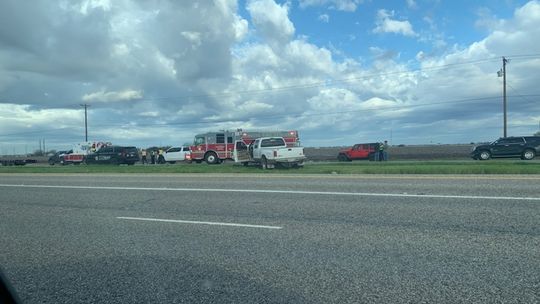 Firefighters and peace officers clear the scene of a fatal accident on U.S. 79 near Limmer Loop in Frame Switch between Taylor and Hutto. Photo by Evan Hale