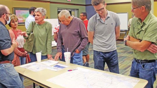 Residents take a look at some of the results from Halff Associates on Taylor’s Drainage Master Plan study during the workshop at the Taylor Public Library Nov. 16, 2021 Photo by Fernando Castro