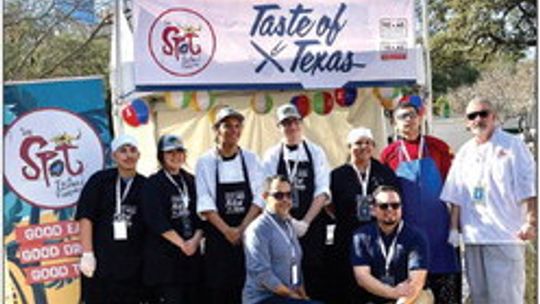 Several students from the Taylor High School’s culinary program, known as the Duck Brigade, assist The Spot from Galveston with serving seafood gumbo at the Governor’s inauguration.