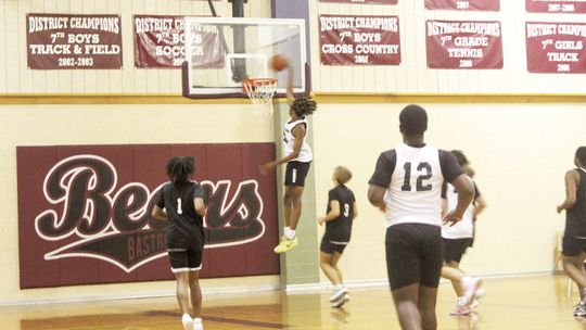 Taylor High School boys varsity basketball senior Treos Richardson soars through the air for a dunk on Monday, June 26 during the Ducks’ summer league scrimmage vs. Cedar Creek High School in Bastrop. Photos by Andrew Salmi