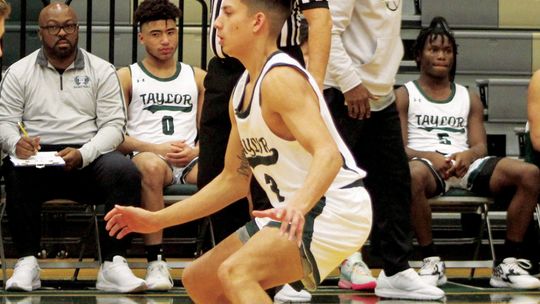 Ducks senior Ladon Velasquez looking for a steal on defense. Photo by Evan Hale