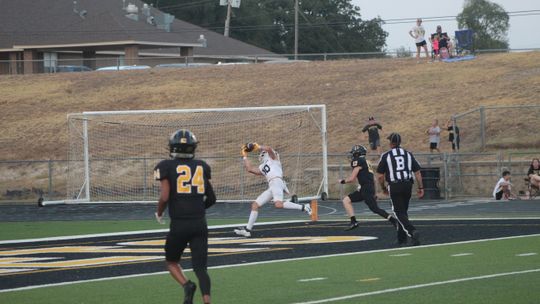 Ducks varsity football senior wide receiver Jacob Mikulencak makes an acrobatic catch for a touchdown on Friday night in Taylor's season opener at Gatesville.