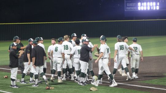 The Taylor High School varsity baseball team celebrates on Thursday, May 25 after the Ducks’ 4-2 victory over Spring Hill High School in Game 1 of the 4A regional semifinals in Midlothian. Photos by Andrew Salmi 
