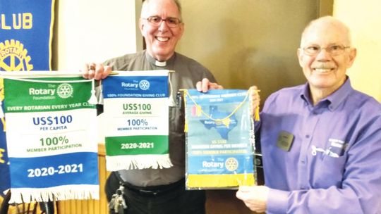 Taylor Rotary Club received three recognitions for the organization’s outstanding work in the community. Past district governor Jerry Chapman (right) presented the awards at the Jan. 27 meeting, who is seen here with Pastor George Qualley. Courtesy photo