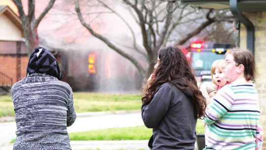 Onlookers watch firefighting efforts on James Street in Taylor March 8. Photo by Matt Hooks