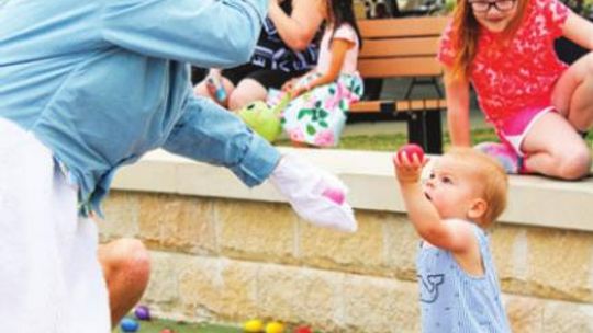 Samuel Madsen shares his eggs with the Easter bunny this past Saturday, April 16, at the Taylor Easter Egg Hunt. Photo by Matt Hooks