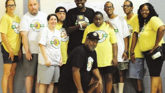 Taylor Press publisher and director of the Taylor Press 3-on-3 Basketball Tournament Jason Hennington is recognized by the Shining Stars for his hard work and commitment. Photo by Larry Pelchat