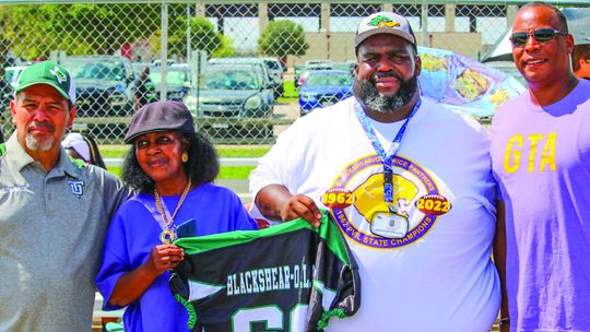 The Youth Ducks organization presented Jennifer Harris (second from left), president of the Blackshear/O.L. Price High School Ex-Students Association, with an official jersey honoring Blackshear/O.L. Price High School. At the presentation were (from left) Fernando Herrera, Youth Ducks pres...