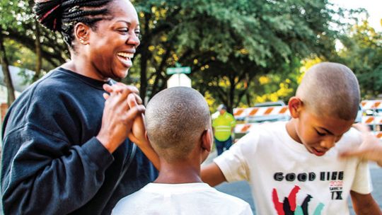 Catherine Rochez congratulates sons Arjae Rochez, 12, and Ruben Rochez, 10, Oct. 8 after the race at Bull Branch Park. Photo by Nicole Lessin