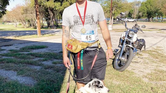 First place finisher in the 21-30 year old age category Jace Gilbreath relaxes after the fifth annual beer run Nov. 5.