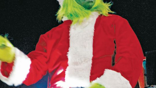 The Grinch rides in a float in the 2021 Taylor Christmas Parade of Lights. Photo by Fernando Castro