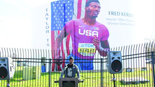 Fred Kerley thanks the Taylor community for its support of him and his family at the mural dedication Saturday morning. Photo by Jason Hennington