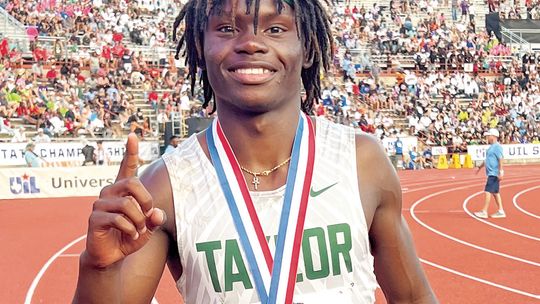 Ducks star Jarvis Anderson shows off his gold medal in the 300-meter hurdles event on May 11 at the UIL Track and Field Championships held at Mike A. Myers Stadium in Austin. Photo by Briley Mitchell