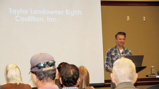 Attorney Chris Johns addresses a group of landowners Jan. 19 at the Taylor Public Library. Photo by Nicole Lessin