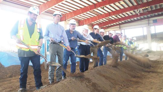 Williamson County officials and more celebrate the groundbreaking of arena improvements to the Williamson County Expo Center in Taylor Feb. 11. Pictured are, from left, Dave Mireles, Dale Butler, Michael Cooper, Scott Badgett, Trent Jacobs, Russ Boles, Jason Brown, Russell Fishbeck, Bill B...