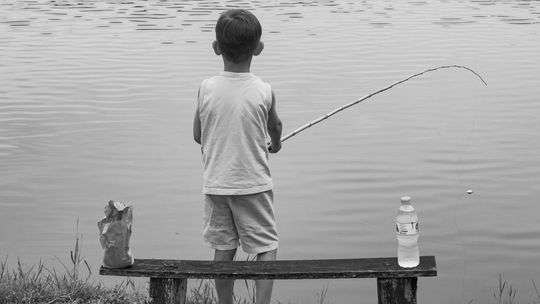 Kid fishing Photo by Paulo Pescada on Unsplash