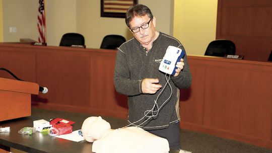 Tim Mikeska, founder of Taylor Heartsaver LLC, demonstrates proper use of an Automated External Defibrillator to the Taylor Independent School District Ambassadors. Courtesy photo