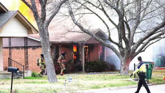 Firefighters battle a blaze in the 900 block of James Street in Taylor March 8. Photo by Matt Hooks