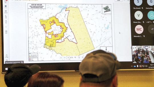 At the Feb. 14 meeting, commissioners consider a map showing a boot-shaped area in white that could potentially be annexed into the service area of ESD 10.