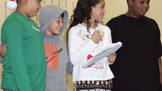 Pasemann Flight School students perform a Christmas themed play for parents just before the holidays. From left are Gael Garcia, La’Nita Starks, and Kenneth Bradford Jr.